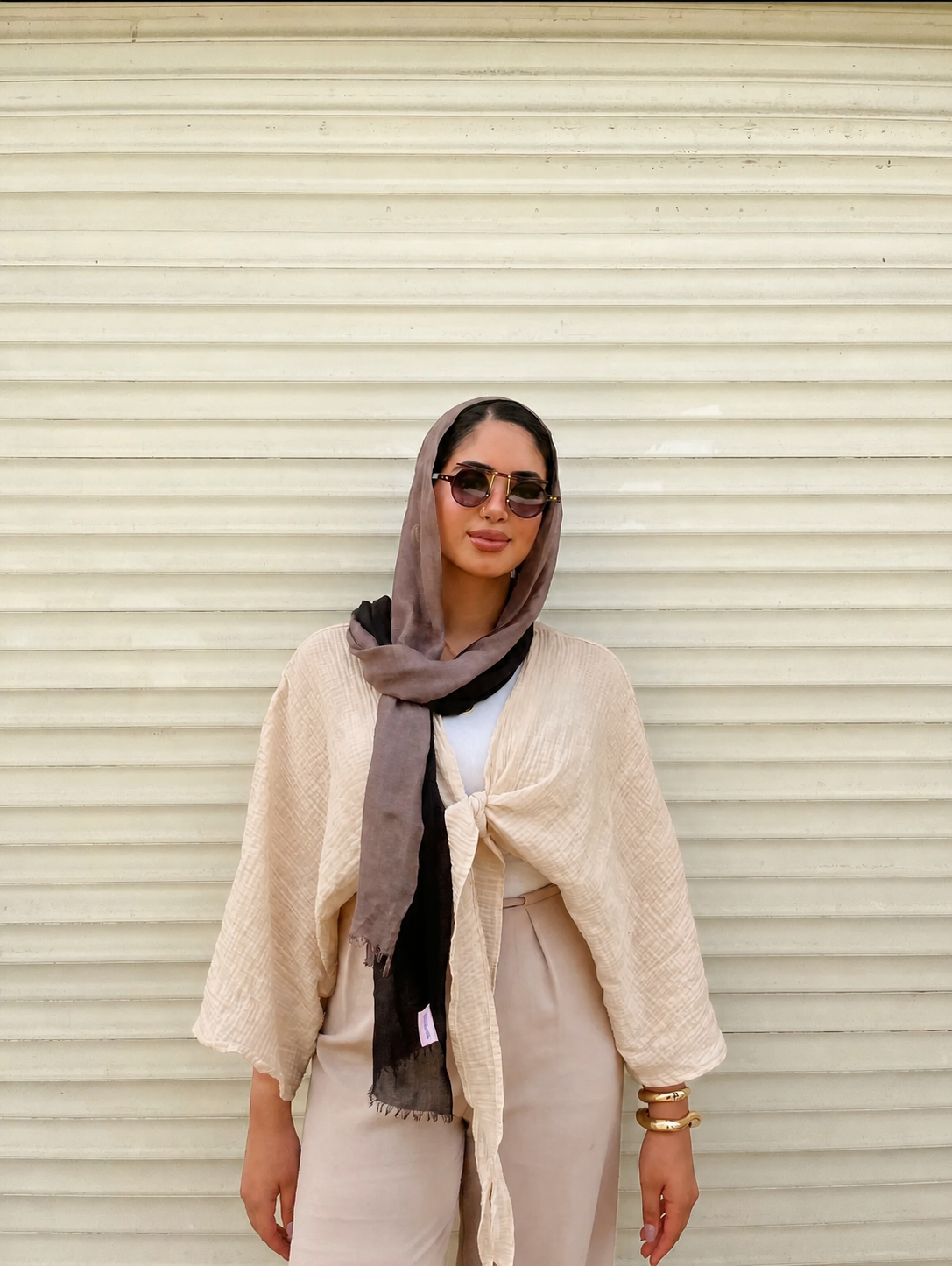 Ocean Breeze Cardigan – elegant beige tie-front cardigan with soft textured fabric and relaxed sleeves, styled with neutral tones and chic accessories for a timeless modest look.